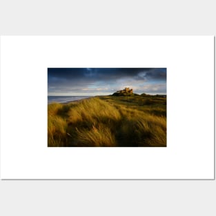 Bamburgh Castle at sunset Posters and Art